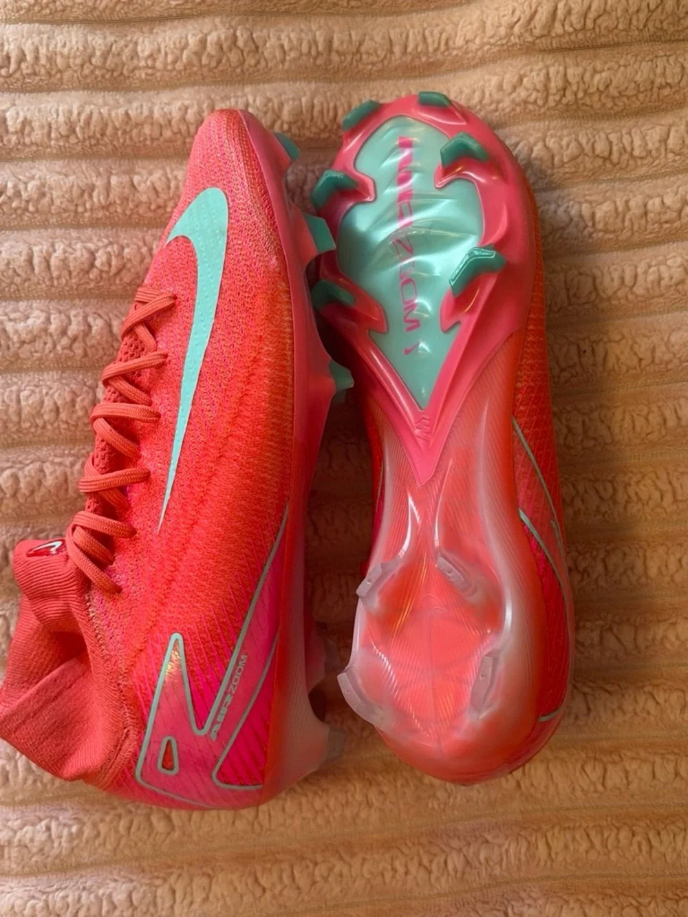 Nike Women's Pink Soccer Cleats with Teal Swoosh